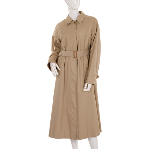 242 - Burberry, a ladies beige overcoat, featuring a short collar, concealed front button fastenings, opti... 