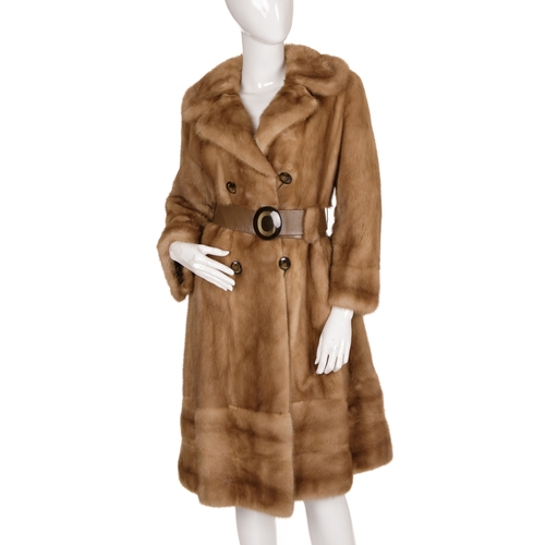 444 - A knee-length fitted pastel mink coat, featuring a notched lapel collar, double-breasted front butto... 