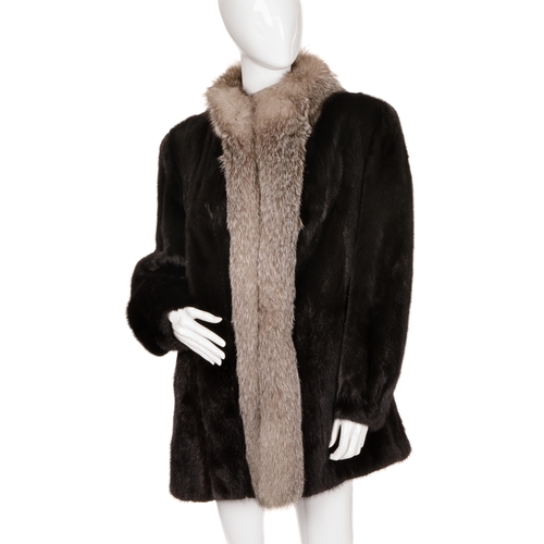 443 - A black mink and fox fur coat, featuring silver fox fur collar and trim, with barrel sleeves and fit... 