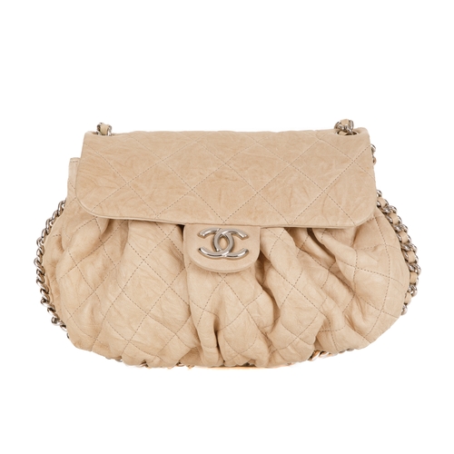 255 - Chanel, a Chain Around Timeless Flap handbag, crafted from cream quilted leather, featuring soft ple... 