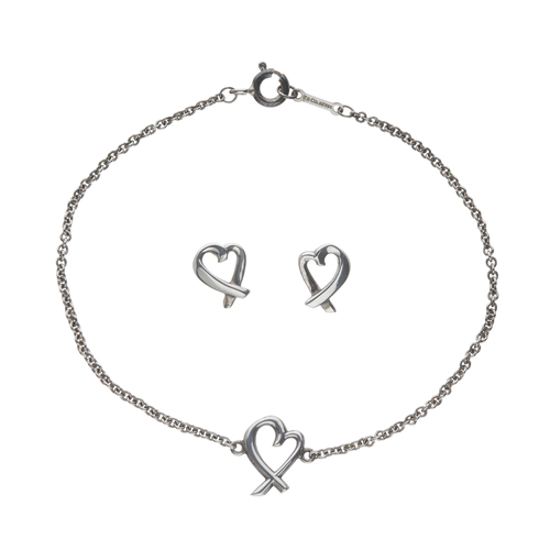 402 - Tiffany & Co., a Paloma Picasso 'Loving Heart' bracelet and matching stud earrings, featuring a cros... 