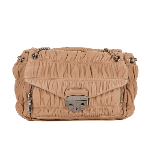 385 - Prada, a Gaufre leather handbag, featuring a gathered beige leather exterior with polished silver-to... 