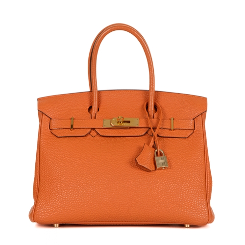 314 - Hermes, a 2004 Birkin 30 handbag, designed with a grained orange leather exterior with gold-plated h... 