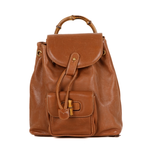 298 - Gucci, a small Bamboo backpack, featuring a smooth tan leather exterior, curved bamboo top handle, f... 