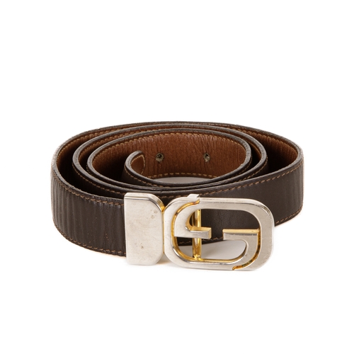 310 - Gucci, a vintage leather belt, crafted from dark brown leather with a stylised GG pin buckle fastene... 