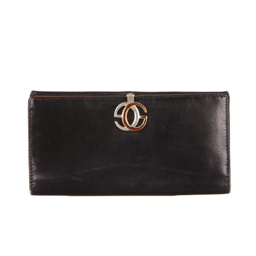 306 - Gucci, a vintage leather wallet, designed with a smooth black leather exterior, featuring a coin com... 