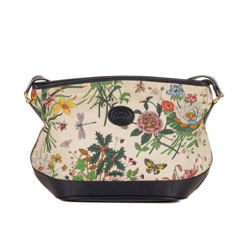 300 - Gucci, a vintage Floral crossbody handbag, designed with a coated canvas exterior with multicoloured... 