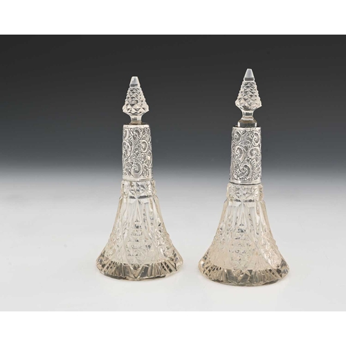 108 - A pair of silver mounted cut glass scent bottles, trumpet form, 17cm high (2)