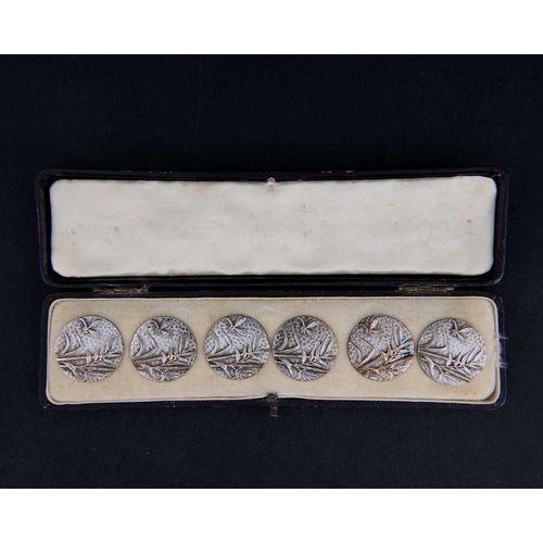 117 - A boxed set of six Aesthetic Movement silver plated buttons, cast in relief with dragonfly and bambo... 