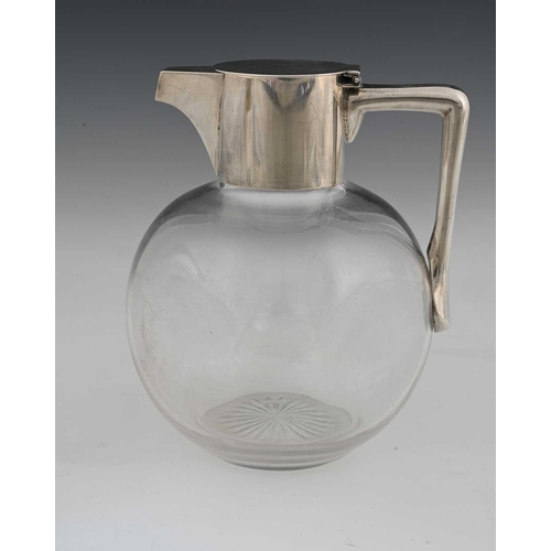 120 - Christopher Dresser for Hukin and Heath, an Aesthetic movement silver mounted glass claret jug, John... 