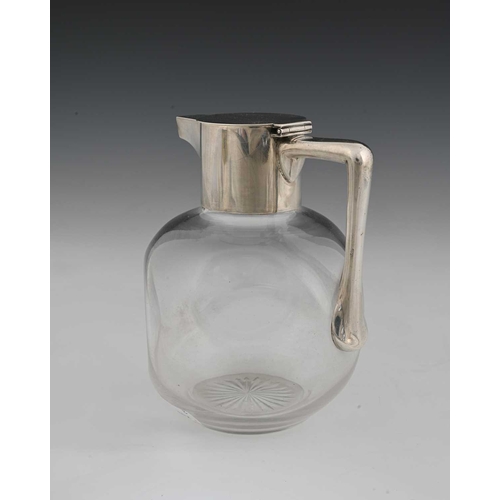 120 - Christopher Dresser for Hukin and Heath, an Aesthetic movement silver mounted glass claret jug, John... 