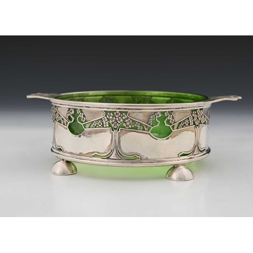 128a - Kate Harris for Goldsmiths and Silversmiths Company, an Arts and Crafts silver and glass bowl, cylin... 