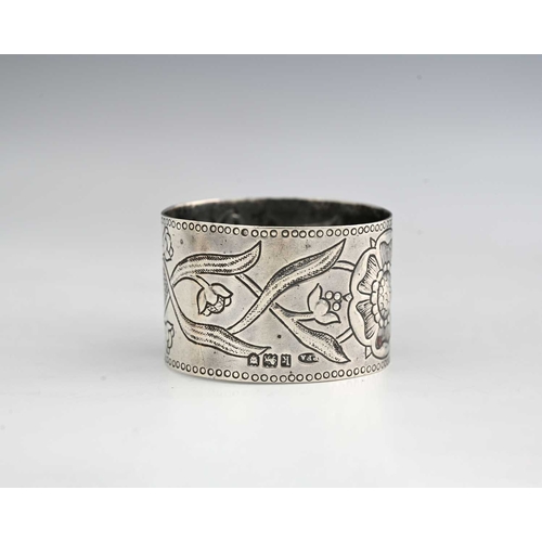 131 - Philip Frederick Alexander, an Arts and Crafts silver napkin ring, London 1905, repousse decorated w... 