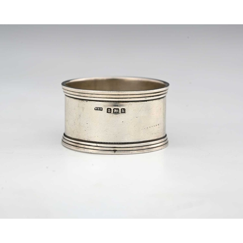 143 - Archibald Knox for Liberty and Co., an Arts and Crafts silver and enamelled napkin ring, Birmingham ... 