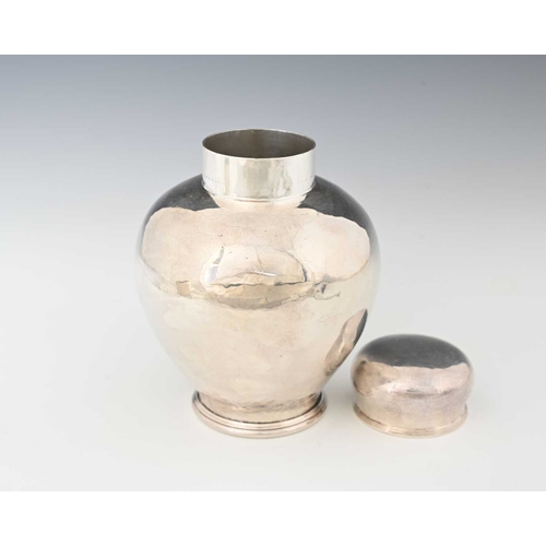 145 - Hart and Huyshe, an Arts and Crafts silvered metal vase and cover, circa 1920, planished inverse bal... 