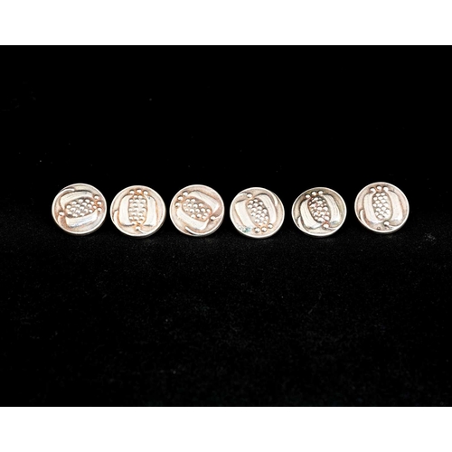 146 - Liberty and Co., a set of six Arts and Crafts silver buttons, Birmingham 1906, embossed with stylise... 