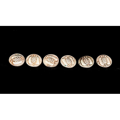 146 - Liberty and Co., a set of six Arts and Crafts silver buttons, Birmingham 1906, embossed with stylise... 