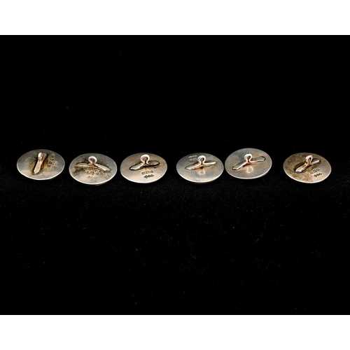 146 - Liberty and Co., a set of six Arts and Crafts silver buttons, Birmingham 1906, embossed with stylise... 