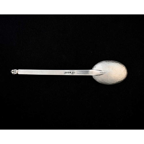 152 - Frances Harling, an Arts and Crafts silver spoon, London 1944, the oval planished bowl on a flat ste... 