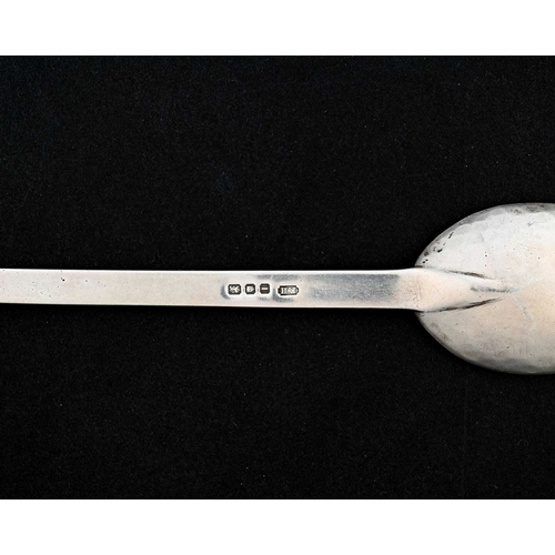 152 - Frances Harling, an Arts and Crafts silver spoon, London 1944, the oval planished bowl on a flat ste... 