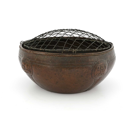 172 - An Arts and Crafts copper bowl, ovoid form, repousse decorated with four roundels bordered and unite... 