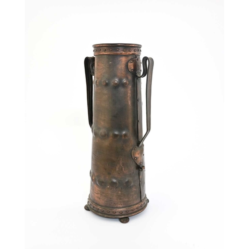 177 - A large Arts and Crafts repousse copper vase, twin handled conical form with riveted bands and handl... 