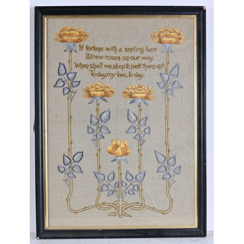 193 - An Arts and Crafts embroidered panel, five stems of yellow roses from a knotted root, around a verse... 