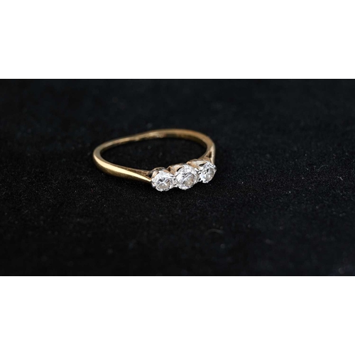 2 - An 18 carat gold three stone diamond ring, size J 1/2, 1.4g