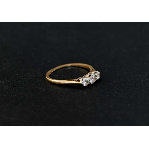 2 - An 18 carat gold three stone diamond ring, size J 1/2, 1.4g