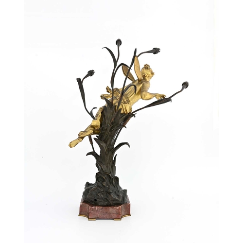 201 - Gustavo Obiols, an Art Nouveau bronze figural lamp, modelled as a gilt fairy supported within a four... 