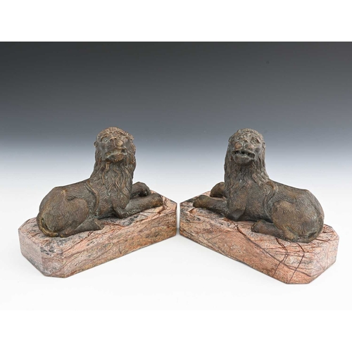 210A - A pair of Italian bronze and marble figures of lions, in the Medieval Renaissance style, modelled re... 