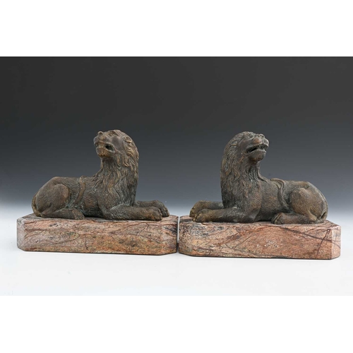 210A - A pair of Italian bronze and marble figures of lions, in the Medieval Renaissance style, modelled re... 