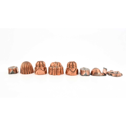 215 - Eight Victorian miniature copper jelly moulds, a pair of circular fluted flat-top designs, one a flu... 