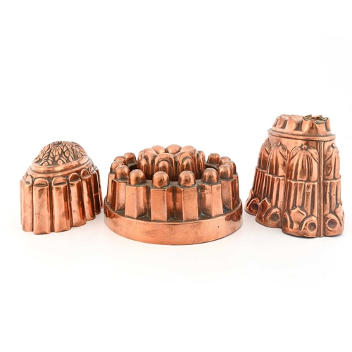 218 - Four Victorian copper jelly moulds, various designs, one an open ring, one with a wheatsheaf design ... 