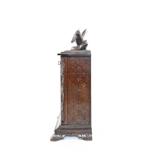 220 - A Black Forest carved country house letter box, the glazed front with foliate scroll reticulated tra... 