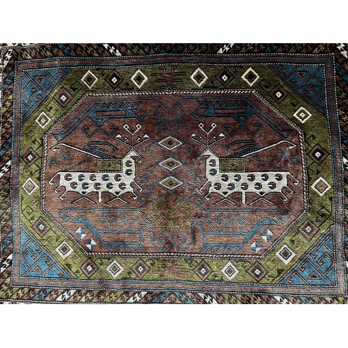 226 - A Soumakh wall hanging, 20th Century, Caucasus region, in earth tones, fringe ends, 95 by 92cm