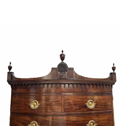 232 - A George III flame mahogany bow-fronted chest on chest, circa 1810, pediment top with urn finials, t... 