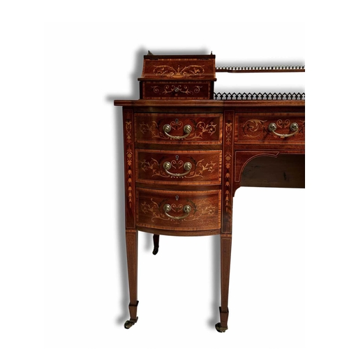 237 - An Edwardian mahogany Carlton House desk, circa 1910, crossbanded, strung and marquetry inlaid throu... 