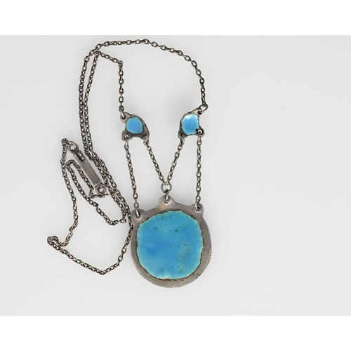 28 - An Arts and Crafts silver and enamelled necklace, in the style of Edith Dawson, the circular pendant... 