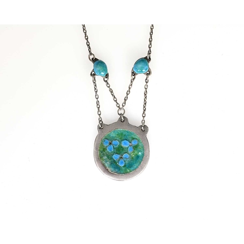 28 - An Arts and Crafts silver and enamelled necklace, in the style of Edith Dawson, the circular pendant... 