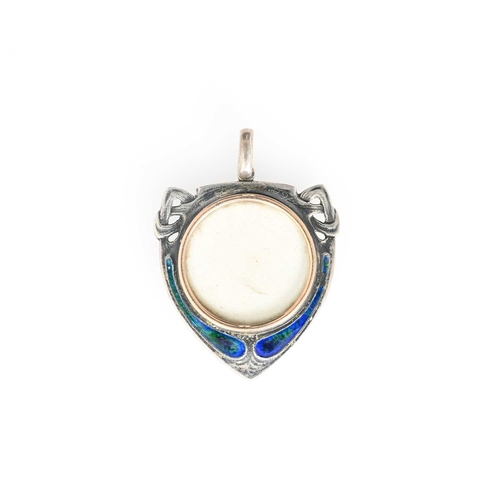 30 - Archibald Knox for Liberty and Co., an Arts and Crafts silver and enamelled locket pendant, shield f... 