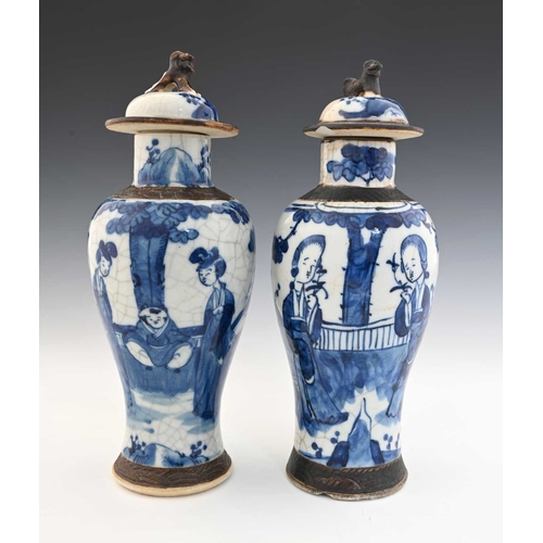 381 - Two Chinese blue and white altar vases, inverse baluster form with rusticated bands and dog finials,... 