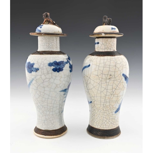 381 - Two Chinese blue and white altar vases, inverse baluster form with rusticated bands and dog finials,... 