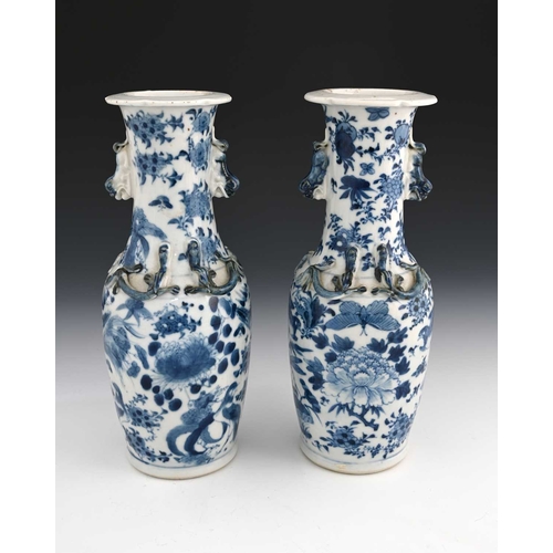 387 - A pair of Chinese blue and white lizard moulded vases, Kangxi marks, shouldered form with shishi dog... 