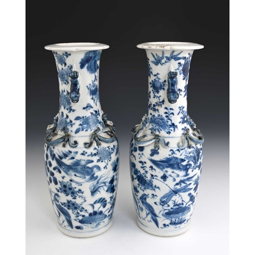 387 - A pair of Chinese blue and white lizard moulded vases, Kangxi marks, shouldered form with shishi dog... 