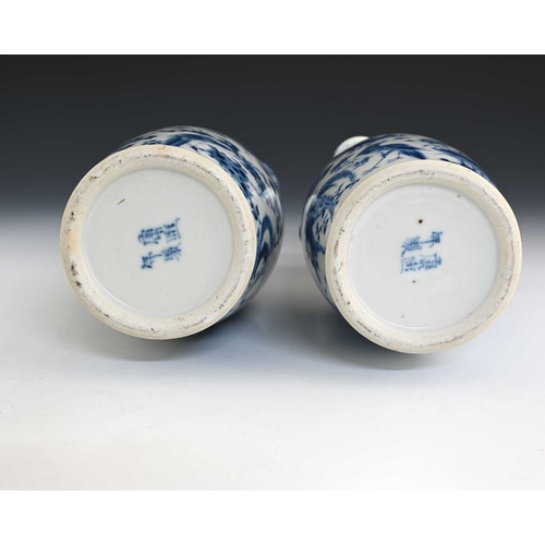 387 - A pair of Chinese blue and white lizard moulded vases, Kangxi marks, shouldered form with shishi dog... 