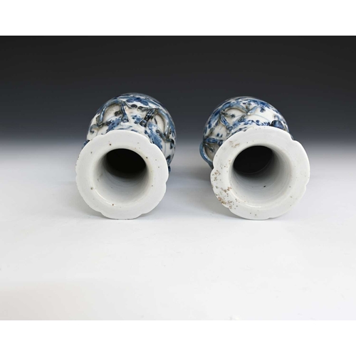 387 - A pair of Chinese blue and white lizard moulded vases, Kangxi marks, shouldered form with shishi dog... 