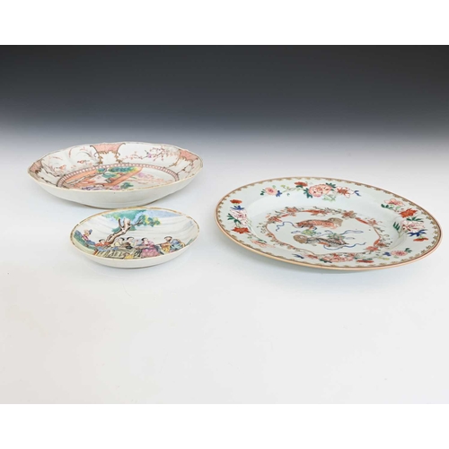 394 - Three Chinese famille rose plates, 18th century, including water carrier garden scene saucer in the ... 