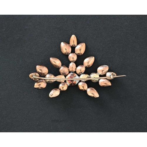 4 - An early 19th century garnet and gold backed brooch, of floral form with variously cut stones, 5.5cm... 