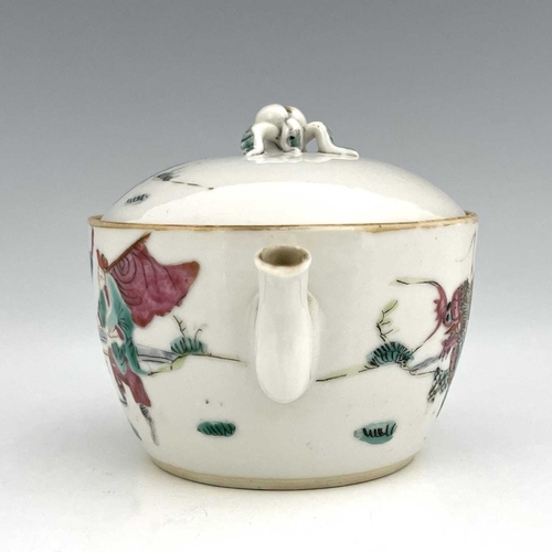 407 - A Chinese famille rose teapot and cover, of small proportions, painted with a deity riding a shishi,... 